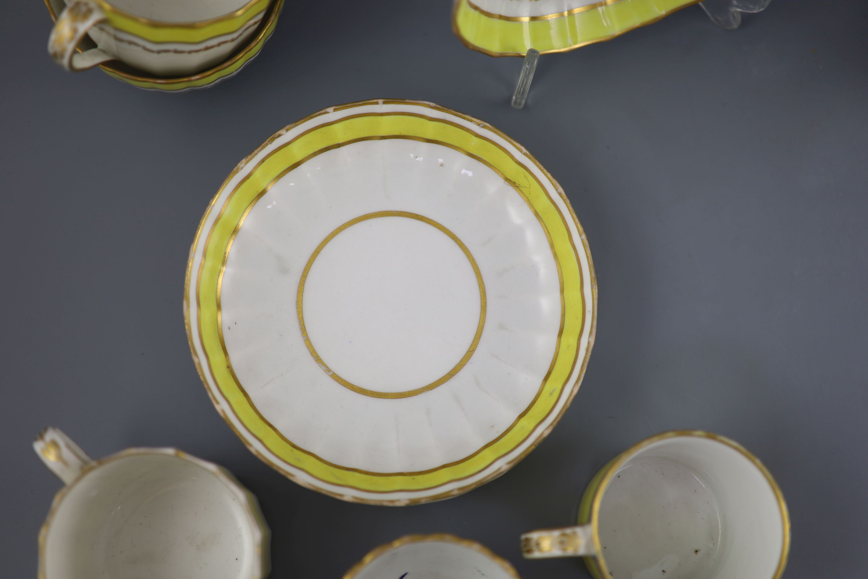 A group of Derby yellow ground tea and coffee wares and a chamberstick, c.1790-1800